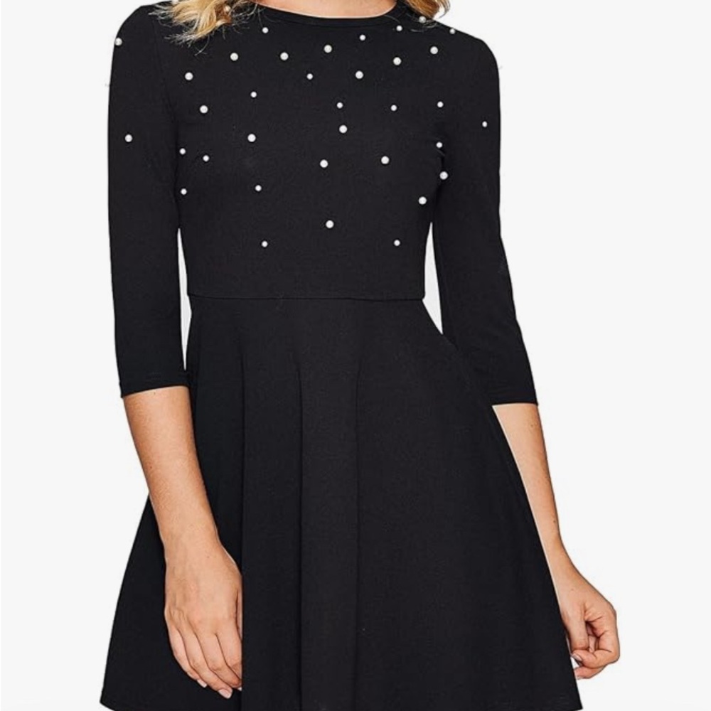 Pin Up style black dress with faux pearls.